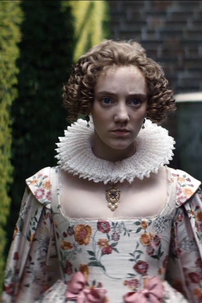 Floral silks, pearls, and the weight of a formal world.